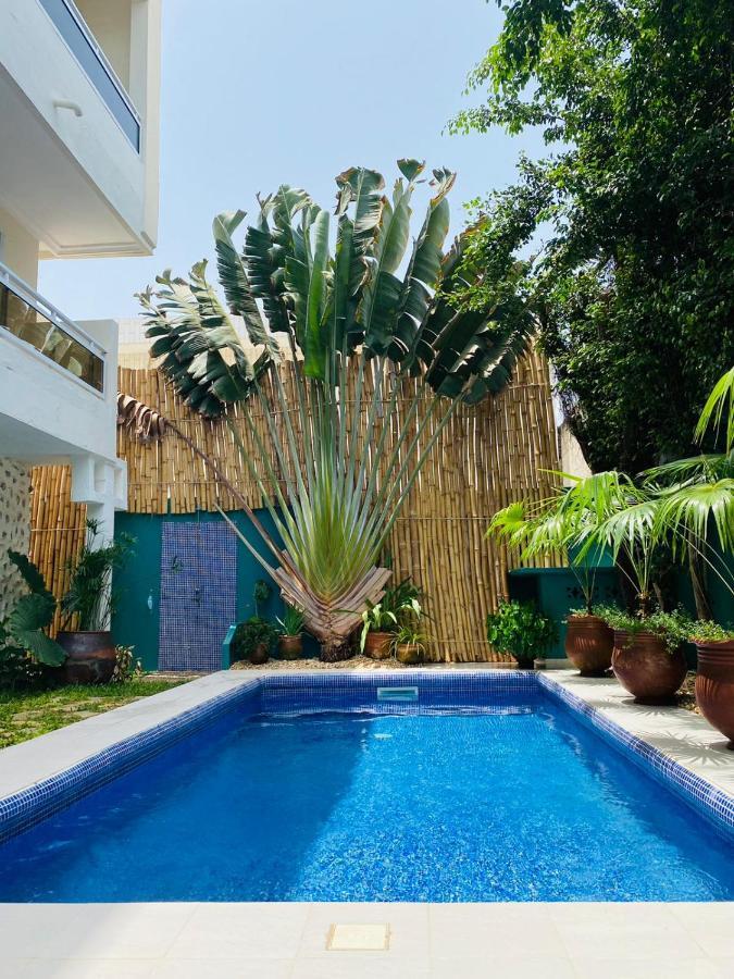 L'Oasis Guesthouse Cotonou Bagian luar foto