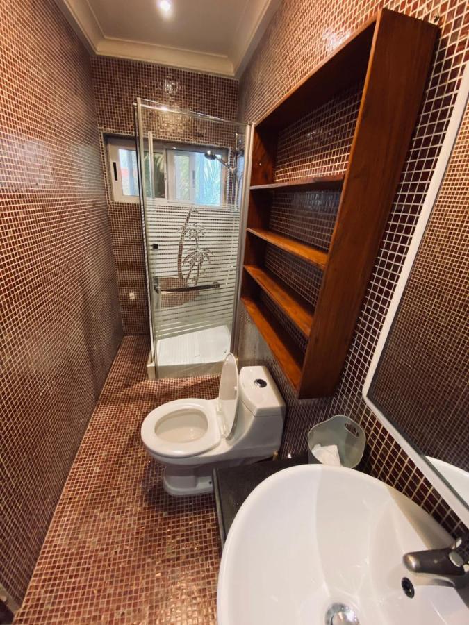 L'Oasis Guesthouse Cotonou Bagian luar foto