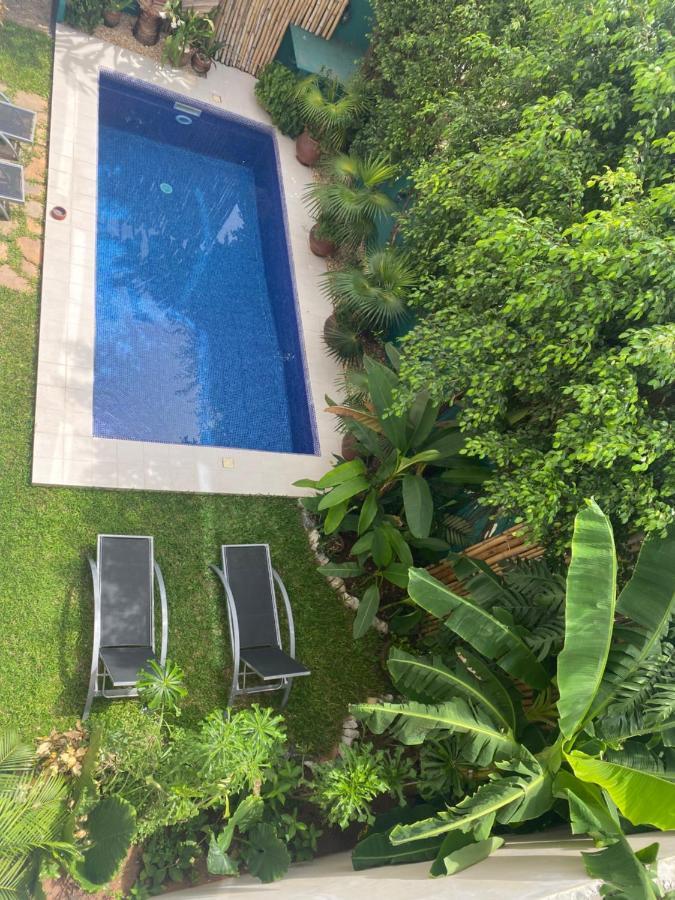 L'Oasis Guesthouse Cotonou Bagian luar foto