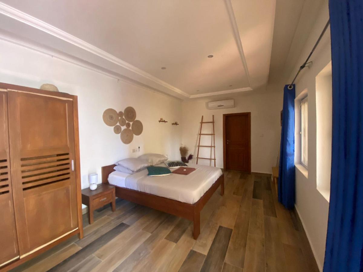 L'Oasis Guesthouse Cotonou Bagian luar foto